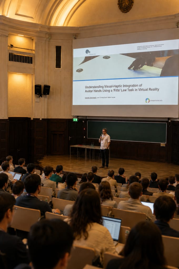 Valentin Schwind giving a talk in the lecture hall